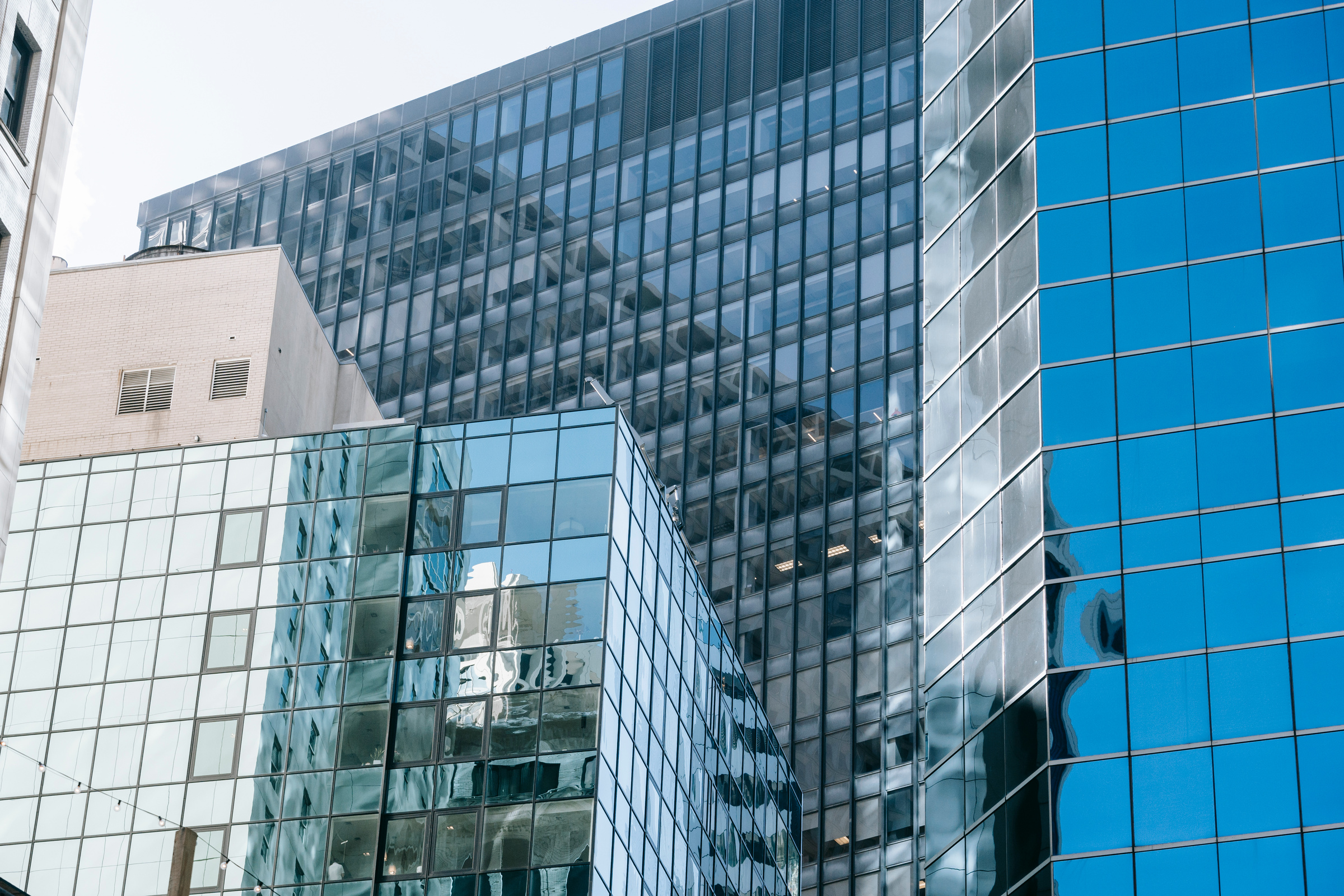 Glass facade of mirrored futuristic buildings